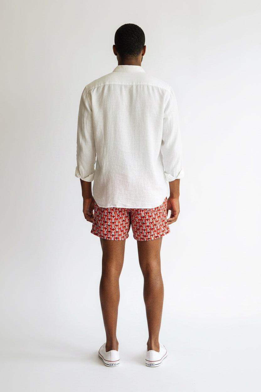 98 Coast Av. men's red zebra print swim shorts with elastic drawstring waistband, model, white shirt, back view
